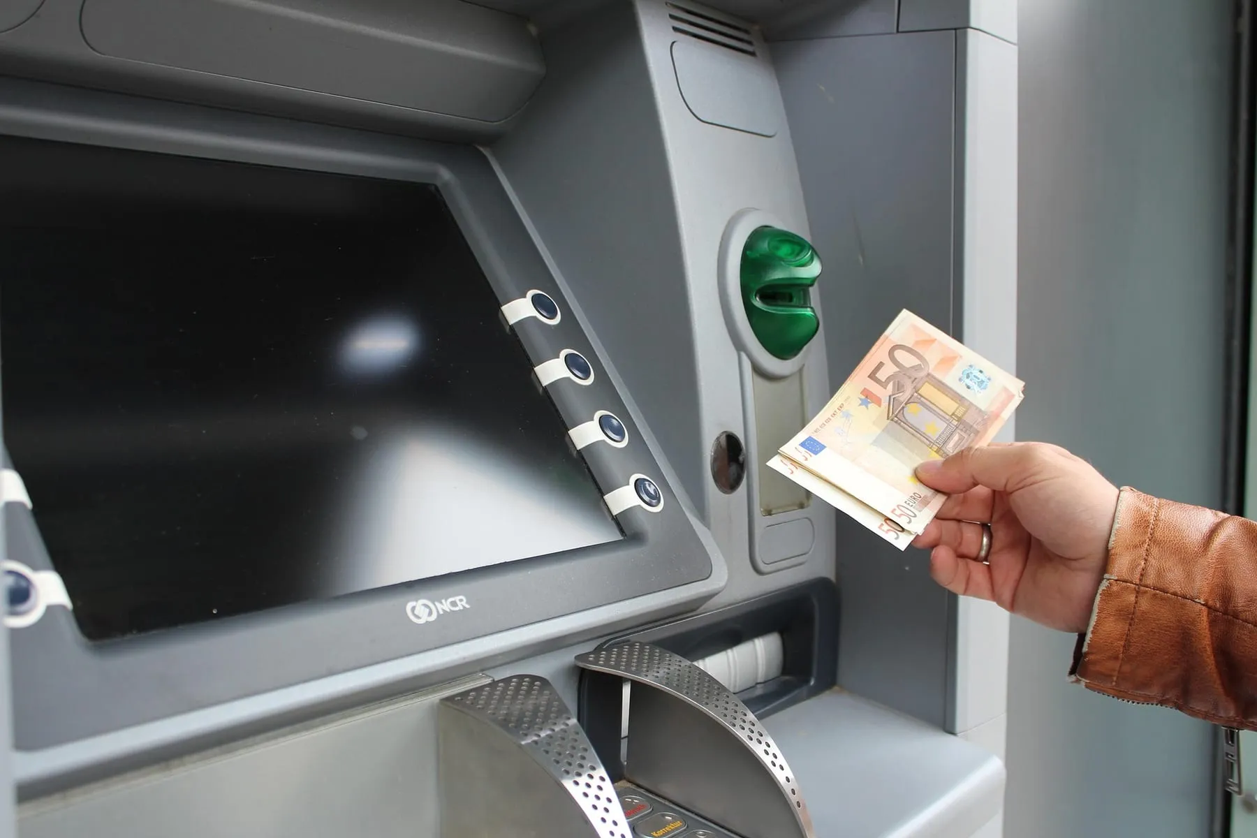 A cash machine keypad and note slot